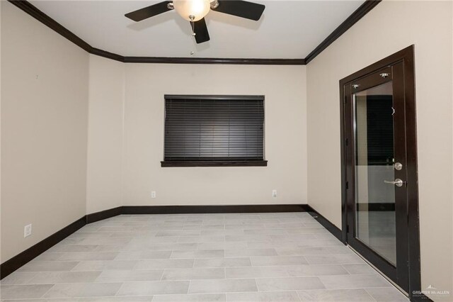 spare room featuring ornamental molding, ceiling fan, and baseboards