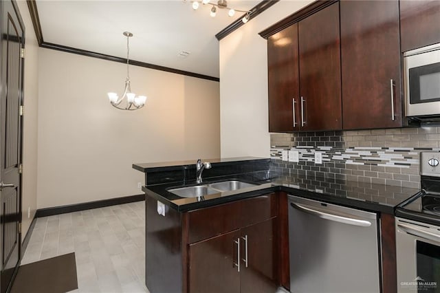 kitchen featuring appliances with stainless steel finishes, crown molding, a sink, and tasteful backsplash