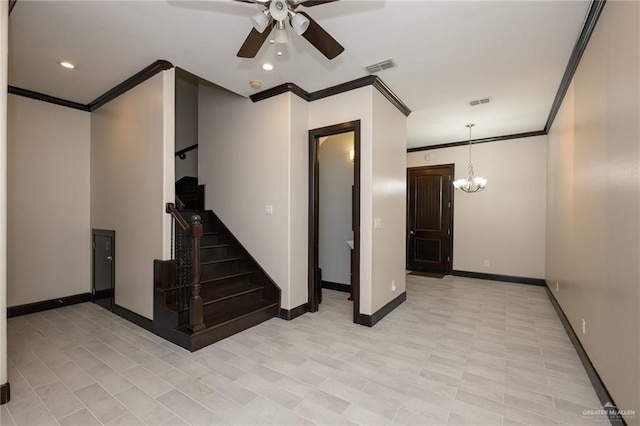 interior space with baseboards, visible vents, crown molding, and ceiling fan with notable chandelier