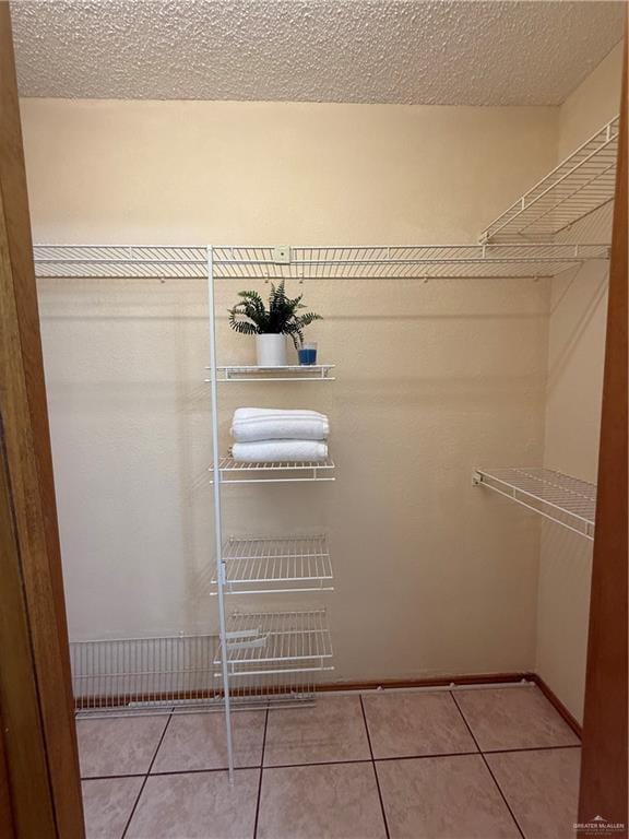 2303 Viola St, Mission, TX 78574 - spacious closet featuring tile patterned flooring