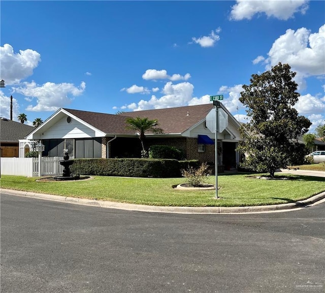 2303 Viola St, Mission, TX 78574 - ranch-style home with fence and a front yard