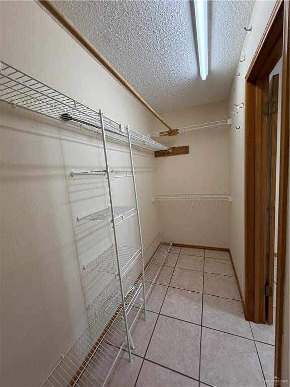 2303 Viola St, Mission, TX 78574 - spacious closet featuring light tile patterned floors