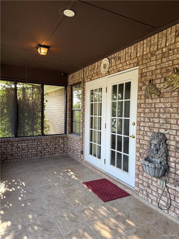 2303 Viola St, Mission, TX 78574 - unfurnished sunroom featuring french doors