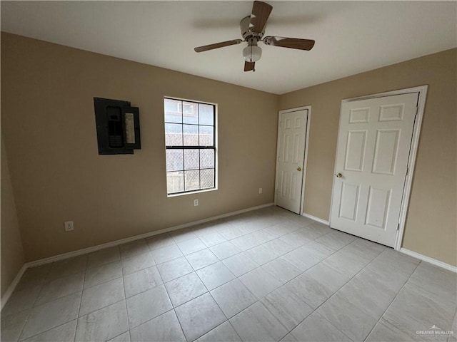 unfurnished bedroom featuring ceiling fan and light tile patterned floors