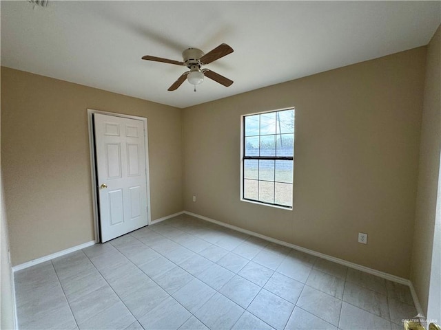 spare room featuring ceiling fan