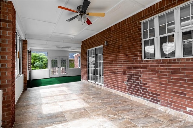 unfurnished sunroom featuring french doors