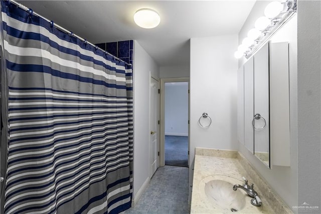 full bath with curtained shower and vanity