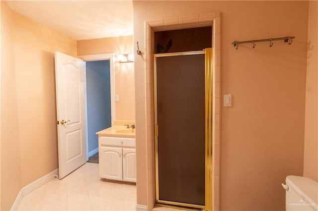 full bath with vanity, baseboards, tile patterned flooring, toilet, and a shower stall
