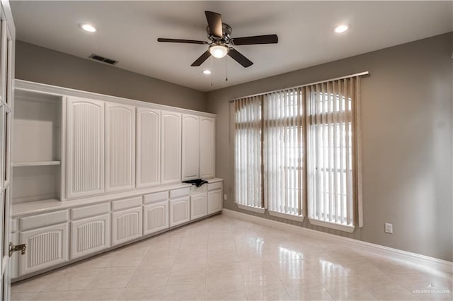 unfurnished bedroom with visible vents, baseboards, recessed lighting, and light tile patterned floors