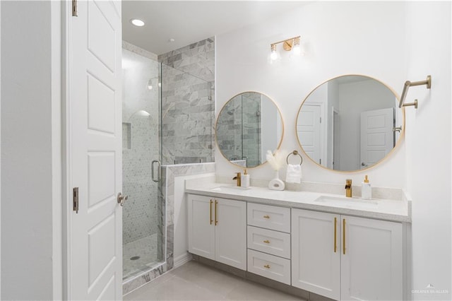 bathroom featuring tile patterned floors, vanity, and walk in shower