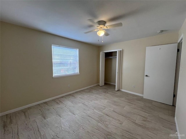 unfurnished bedroom with a closet, baseboards, and a ceiling fan