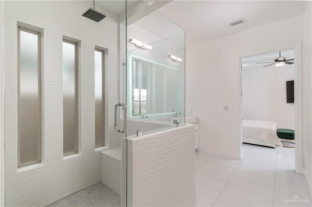 bathroom featuring ceiling fan, tile patterned flooring, and walk in shower