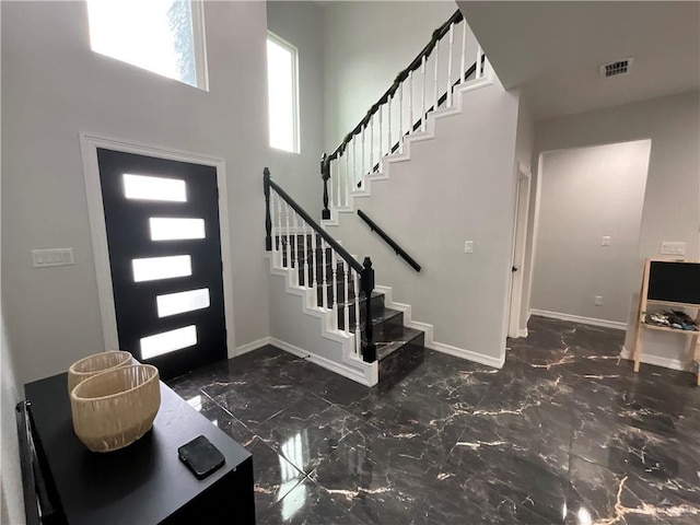 1213 Emma Elizabeth St, Weslaco, TX 78599 - entryway with stairway, marble finish floors, and a high ceiling