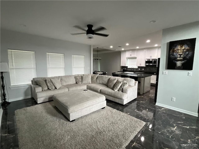 1213 Emma Elizabeth St, Weslaco, TX 78599 - living area featuring ceiling fan, recessed lighting, dark marble finish flooring, and a chandelier