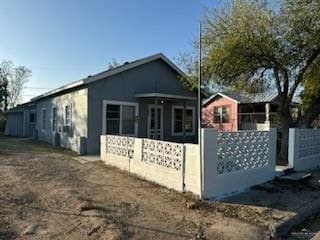 view of home's exterior featuring fence