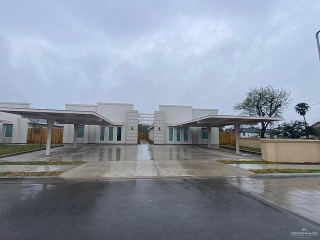 view of front of property with a carport