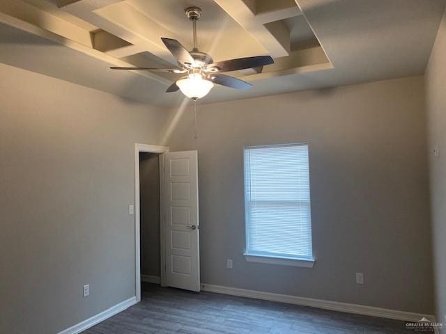 spare room featuring dark hardwood / wood-style floors and ceiling fan