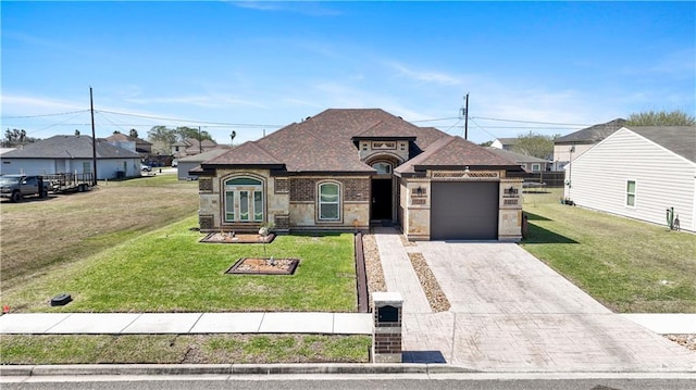 french provincial home with decorative driveway, brick siding, a shingled roof, an attached garage, and a front lawn