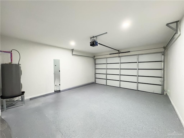 garage featuring a garage door opener and electric water heater