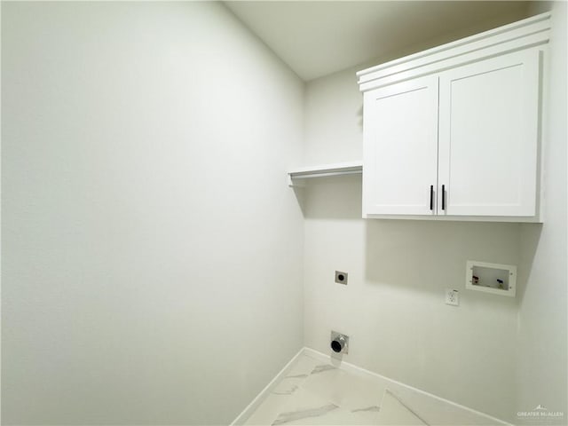 laundry area with cabinets, hookup for an electric dryer, and hookup for a washing machine