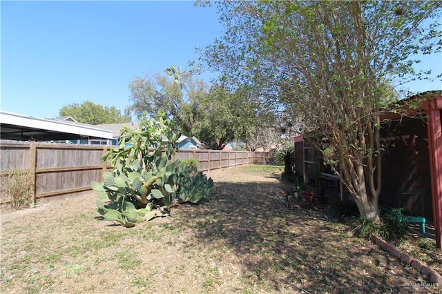 view of yard with a fenced backyard