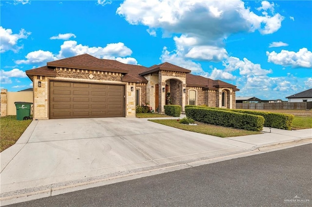 view of front of property with a garage