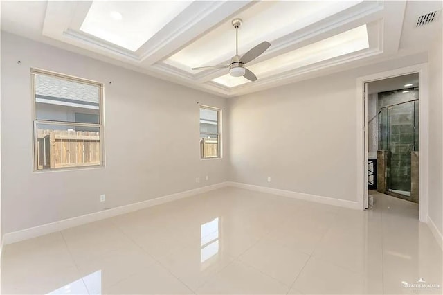 tiled spare room with ceiling fan and coffered ceiling