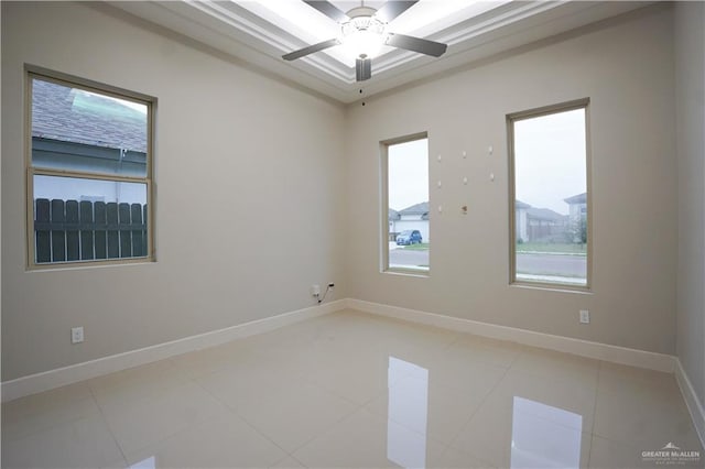 empty room with tile patterned floors and ceiling fan