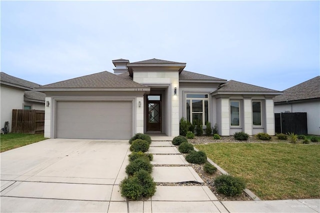 prairie-style house with a front lawn and a garage