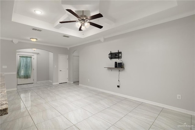 1041 Arroyo Cir, Mercedes, TX 78570 - unfurnished room with arched walkways, a ceiling fan, a tray ceiling, and crown molding