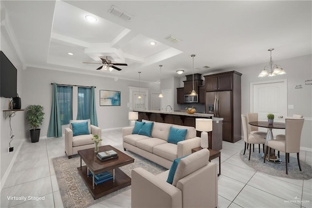 1041 Arroyo Cir, Mercedes, TX 78570 - living room with coffered ceiling, a chandelier, light tile patterned flooring, ceiling fan, and baseboards