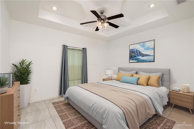 1041 Arroyo Cir, Mercedes, TX 78570 - bedroom featuring a tray ceiling, recessed lighting, a ceiling fan, baseboards, and light tile patterned floors