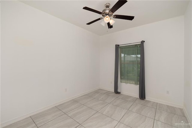 1041 Arroyo Cir, Mercedes, TX 78570 - empty room with a ceiling fan, light tile patterned floors, and baseboards