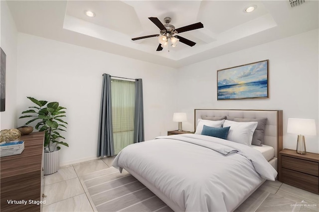 1041 Arroyo Cir, Mercedes, TX 78570 - bedroom featuring a tray ceiling, recessed lighting, ceiling fan, light tile patterned floors, and baseboards