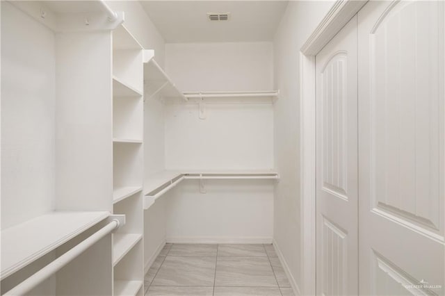 1041 Arroyo Cir, Mercedes, TX 78570 - spacious closet featuring light marble finish floors