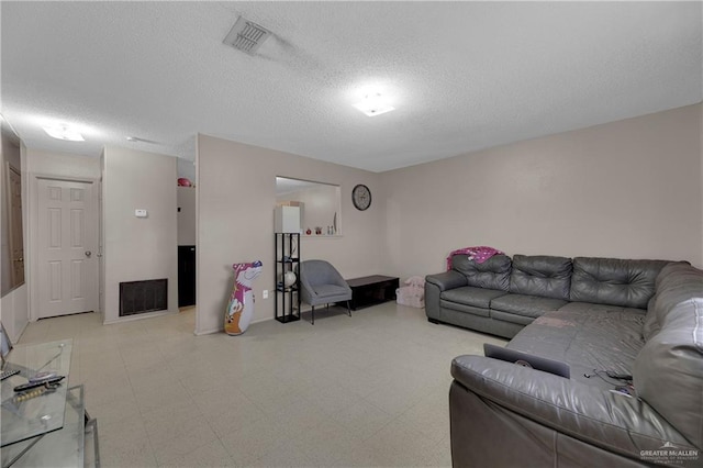 living room featuring a textured ceiling