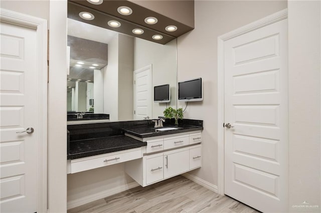 bathroom featuring wood-type flooring and vanity