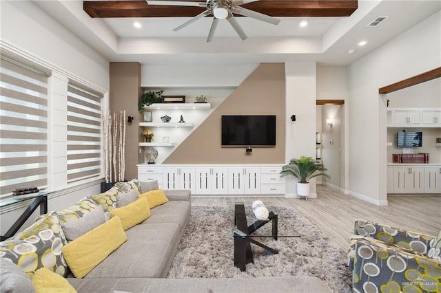 living room featuring ceiling fan and light hardwood / wood-style flooring