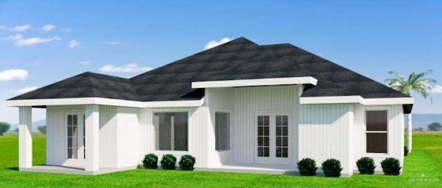 610 Makayla Dr, San Juan, TX 78589 - rear view of house featuring a yard