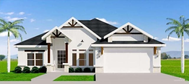 610 Makayla Dr, San Juan, TX 78589 - view of front of property with driveway, a front yard, and a garage