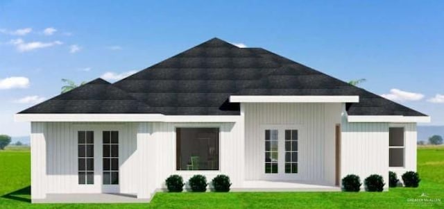 610 Makayla Dr, San Juan, TX 78589 - rear view of house with a yard