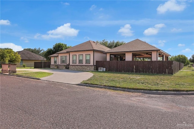 12813 N 106th St, Mission, TX 78573 - view of front of property featuring driveway and stone siding