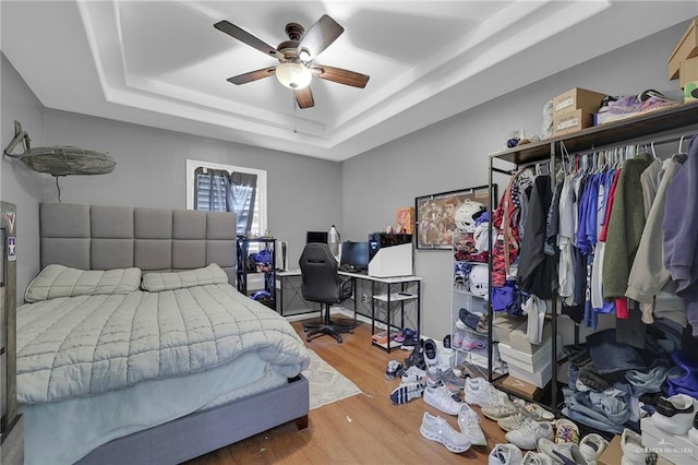 12813 N 106th St, Mission, TX 78573 - bedroom with a raised ceiling, wood finished floors, an office area, and ceiling fan