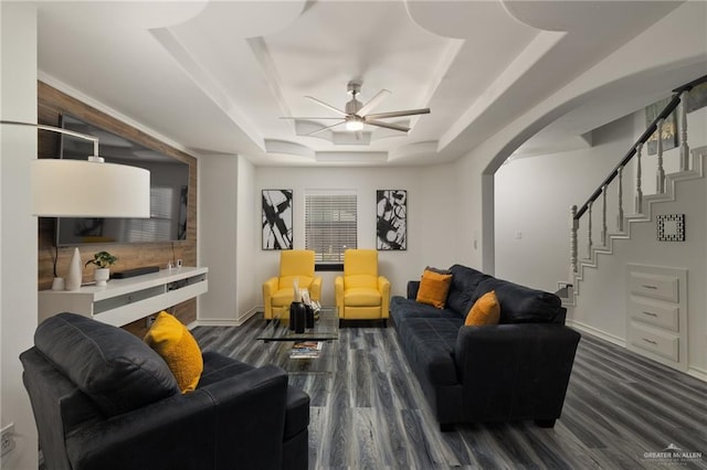 2715 Melanie Dr, Pharr, TX 78577 - living room with a ceiling fan, stairs, a raised ceiling, arched walkways, and wood finished floors
