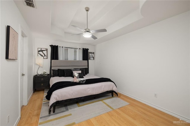 2715 Melanie Dr, Pharr, TX 78577 - bedroom with a raised ceiling, wood finished floors, and baseboards