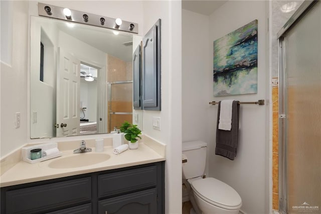 2715 Melanie Dr, Pharr, TX 78577 - bathroom with toilet, vanity, and a shower with shower door