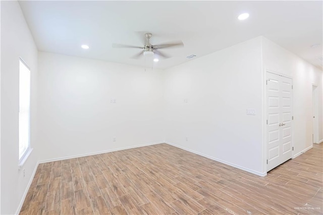 1046 Hidalgo St, Mercedes, TX 78570 - unfurnished room featuring ceiling fan, light wood-style floors, baseboards, plenty of natural light, and recessed lighting
