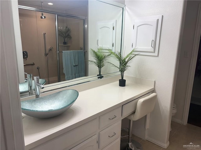 824 Lucy Dr, Alamo, TX 78516 - full bathroom featuring a stall shower, vanity, tile patterned floors, and toilet