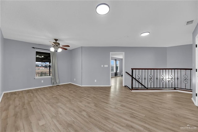5801 N 36th St, Mcallen, TX 78504 - empty room featuring a ceiling fan, light wood-style floors, and baseboards