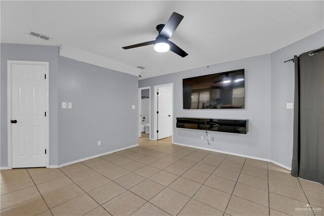 5801 N 36th St, Mcallen, TX 78504 - unfurnished living room featuring light tile patterned floors, a ceiling fan, and baseboards